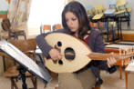 palestinina girl playing music in Palestine